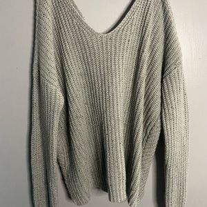 Grey sweater with twisted back